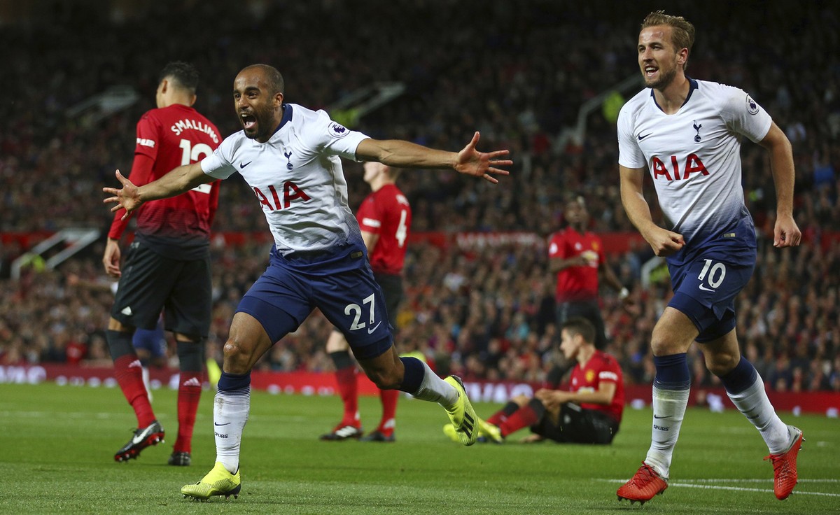 Tottenham Hotspur's Lucas Moura, left, celebrates with Harry Kane after scoring his side's second goal during the English Premier League soccer match between Manchester United and Tottenham  ...