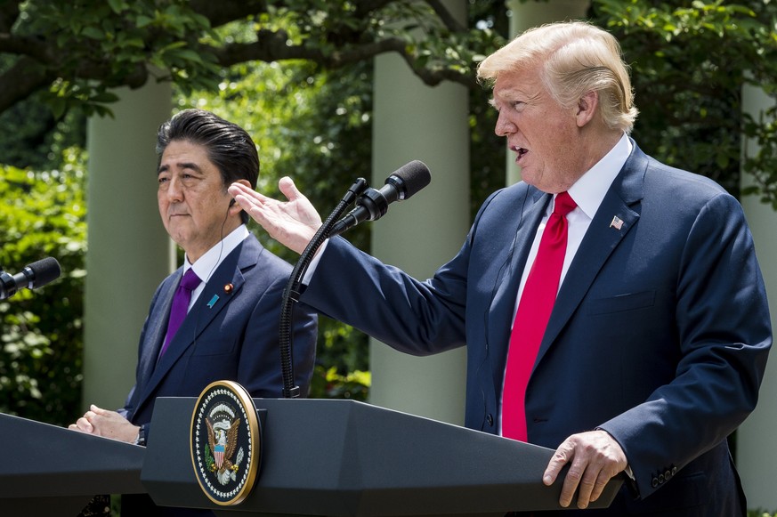 epa06791839 US President Donald J. Trump (R) and Japanese Prime Minister Shinzo Abe (L) participate in a joint press conference in the Rose Garden of the White House in Washington, DC, USA, 07 June 20 ...