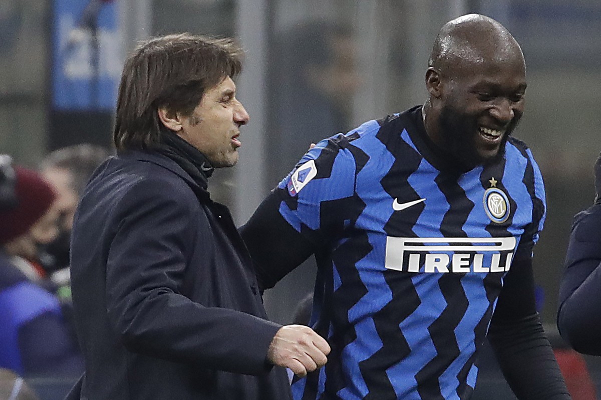 Inter Milan's head coach Antonio Conte congratulates his player Romelu Lukaku who scores the two goals during a Serie A soccer match between Inter Milan and Lazio at the San Siro stadium in Milan ...