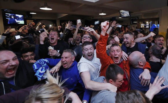 Britain Football Soccer - Leicester City fans watch the Chelsea v Tottenham Hotspur game in pub in Leicester - 2/5/16
Leicester City fans celebrate winning the Premier League
Reuters / Eddie Keogh
 ...