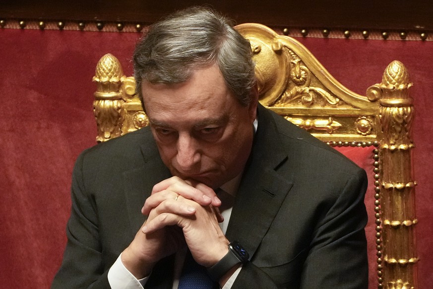 Italian Premier Mario Draghi attends a debate at the Senate in Rome, Wednesday, July 20, 2022. Draghi was deciding Wednesday whether to confirm his resignation or reconsider appeals to rebuild his par ...