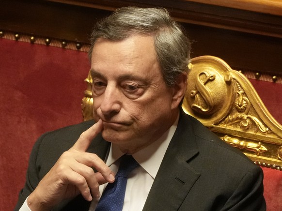 Italian Premier Mario Draghi attends a debate at the Senate in Rome, Wednesday, July 20, 2022. Draghi was deciding Wednesday whether to confirm his resignation or reconsider appeals to rebuild his par ...