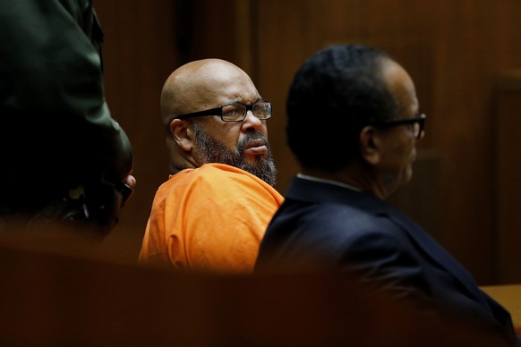 Marion &quot;Suge&quot; Knight, left, with his defense attorney Albert DeBlanc Jr., right, appears in court pleading no contest to voluntary manslaughter in front of Judge Ronald S. Coen in Los Angele ...