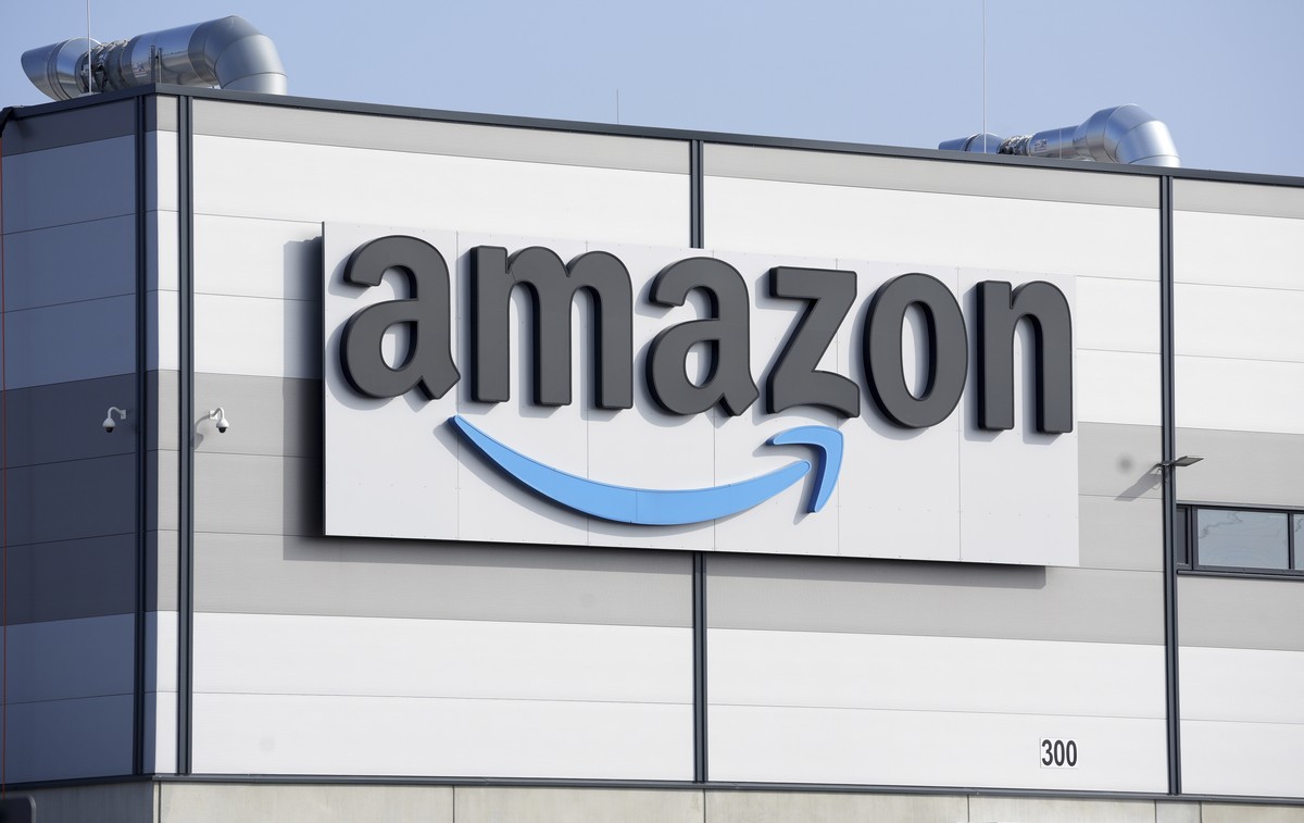 FILE - An Amazon company logo marks the facade of a building, March 18, 2022, in Schoenefeld near Berlin. AP Photo/Michael Sohn, File)
Earns Amazon