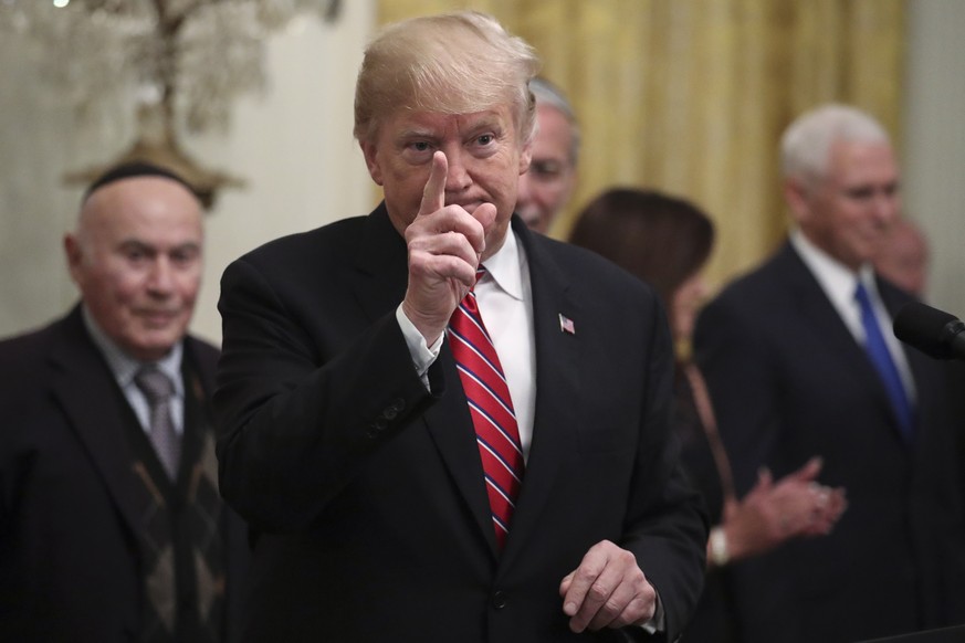 epa07213567 US President Donald J. Trump gestures as he speaks during a Hanukkah reception in the East Room of the White House in Washington, DC, USA, 06 December 2018. EPA/Oliver Contreras / POOL