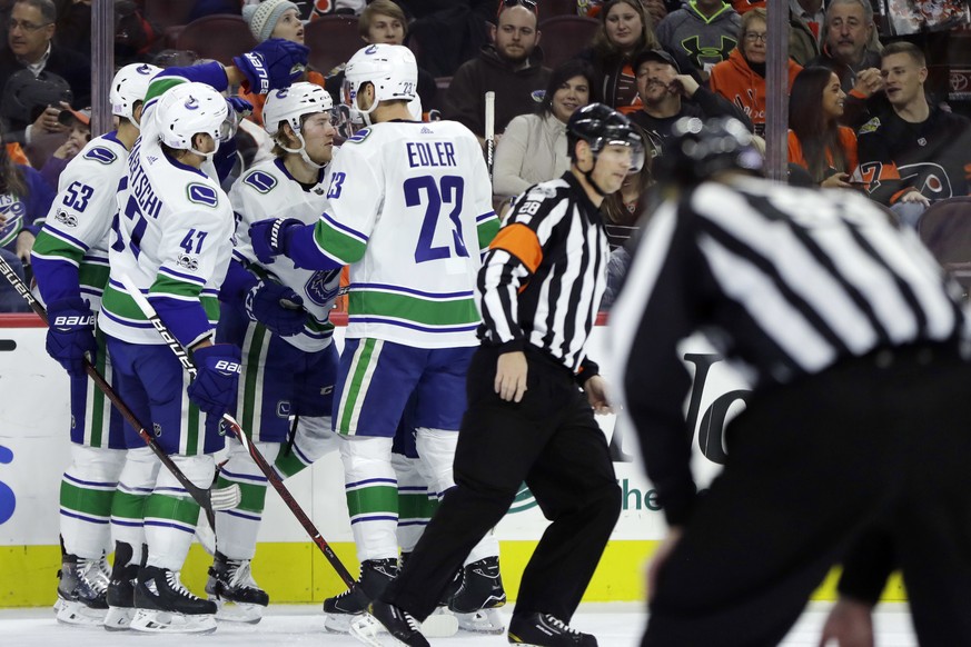 Vancouver Canucks&#039; Brock Boeser (6) celebrates with his teammates after scoring a goal during the first period of an NHL hockey game against the Philadelphia Flyers, Tuesday, Nov. 21, 2017, in Ph ...