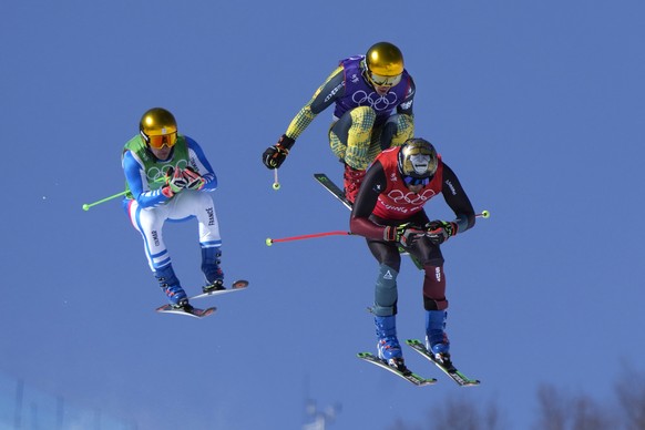 Switzerland&#039;s Alex Fiva leads the pack, followed by Germany&#039;s Daniel Bohnacker and France&#039;s Jean Frederic Chapuis, left, during the men&#039;s cross finals at the 2022 Winter Olympics,  ...