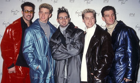 LOS ANGELES - JANUARY 11: Pop group NSYNC: Joey Fatone, Justin Timberlake, Chris Kirkpatrick, Lance Bass and JC Chasez attend the 26th Annual American Music Awards on January 11, 1999 at the Shrine Au ...