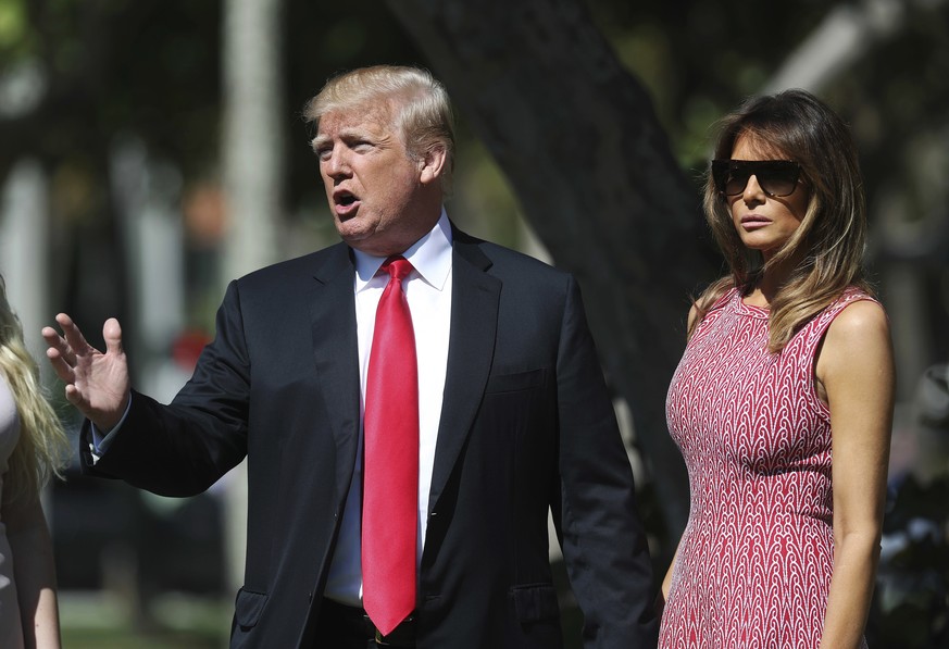President Donald Trump stops to speak to members of the media as he arrives for Easter services with first lady Melania Trump at Episcopal Church of Bethesda-by-the-Sea in Palm Beach, Fla., Sunday, Ap ...