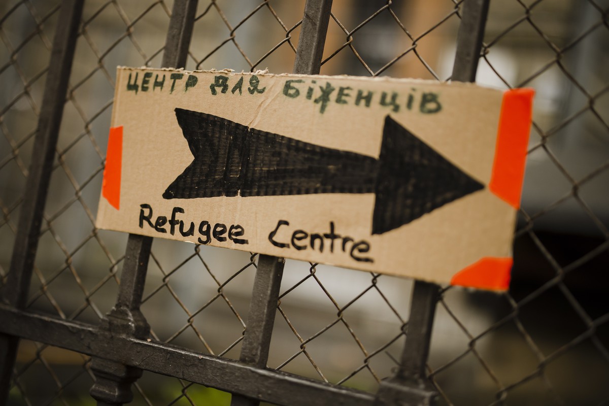 epa09826447 A sign reading 'Refugee Centre' is seen at the reception center for refugees, following Russia's invasion of Ukraine, in Zurich, Switzerland, 15 March 2022. According to fig ...