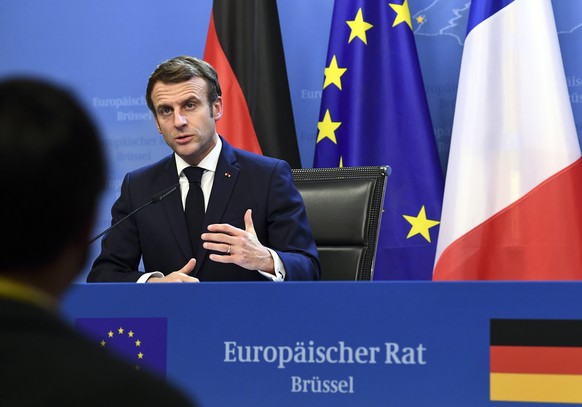 epa09645879 France&#039;s President Emmanuel Macron speaks during a joint press conference with Germany&#039;s Chancellor Olaf Scholz (out of frame) during an European Union (EU) summit at the Europea ...