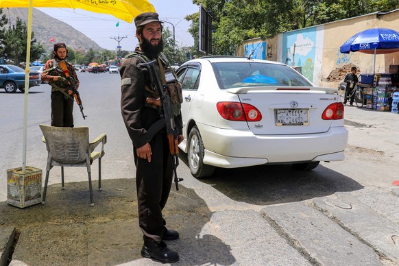 epa10805734 Taliban&#039;s security stand guard at a check point in Kabul, Afghanistan, 18 August 2023. A Taliban imposed ban on political parties, citing them as un-Islamic and responsible for decade ...