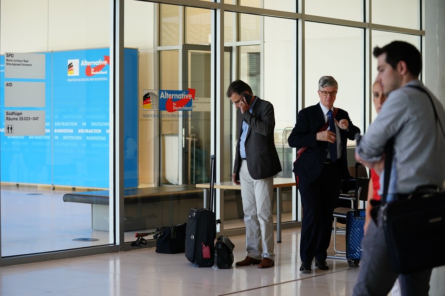 epa07680371 MPs of right-wing populist party Alternative for Germany (AfD) stand outside their Bundestag faction&#039;s meeting room, in Berlin, Germany, 28 June 2019. The retreat of the AfD Bundestag ...