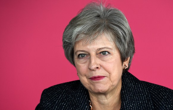 epa07085407 British Prime Minister Theresa May (R) speaks as she meets with business leaders in central London, Britain, 11 October 2018. May is set to brief her ministers later over Brexit negotiatio ...