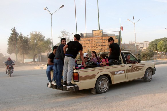 epa07910203 Kurdish families flee their home towns Ras al-Ein due to the Turkish offensive in northern Syria, 10 October 2019. Turkey has launched an offensive targeting Kurdish forces in north-easter ...