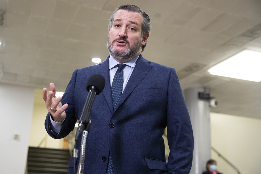 epa09010230 Republican Senator from Texas Ted Cruz responds to questions from members of the news media during a break on the fifth day of the second impeachment trial of US President Donald J. Trump  ...