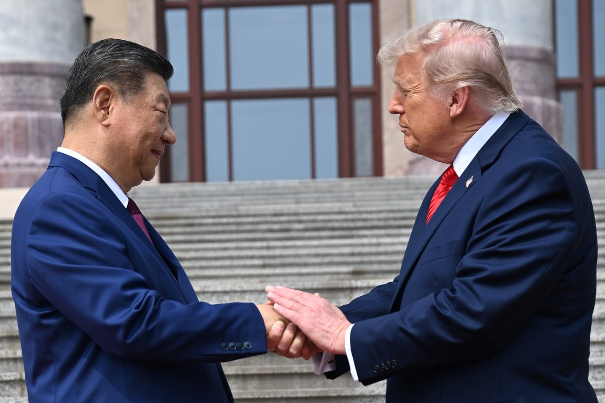 Chinese President Xi Jinping, left, shakes hands with U.S. President Donald Trump at the Great Hall of the People in Beijing, Thursday, May 14, 2026. (Kenny Holston/Pool Photo via AP)
Donald Trump,Xi  ...