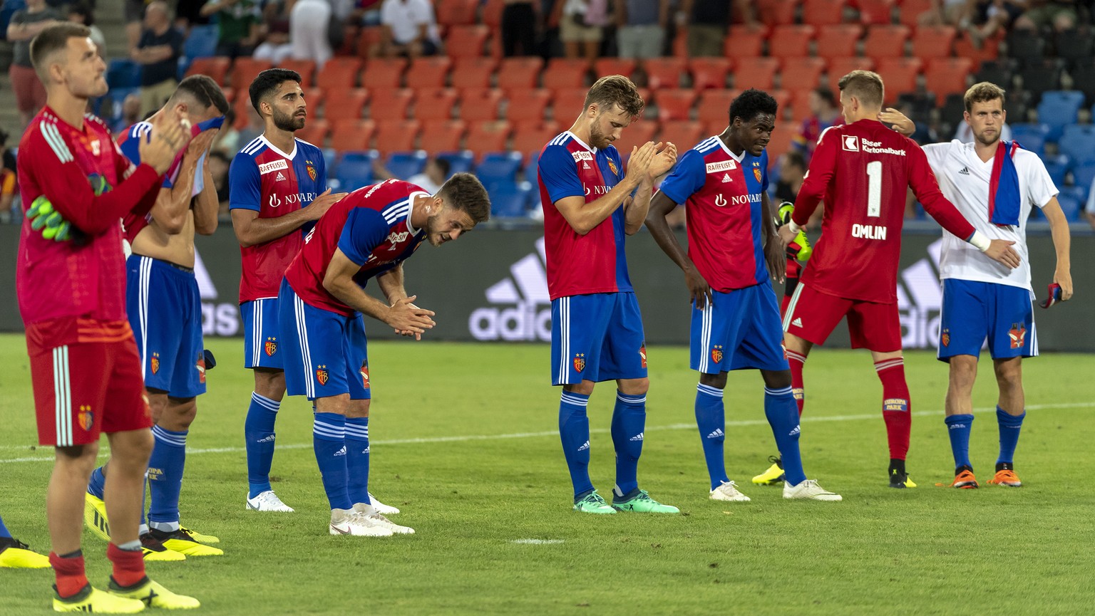 Basel&#039;s disappointed players thank the fans after the UEFA Champions League second qualifying round second leg match between Switzerland&#039;s FC Basel 1893 and Greece&#039;s PAOK FC in the St.  ...