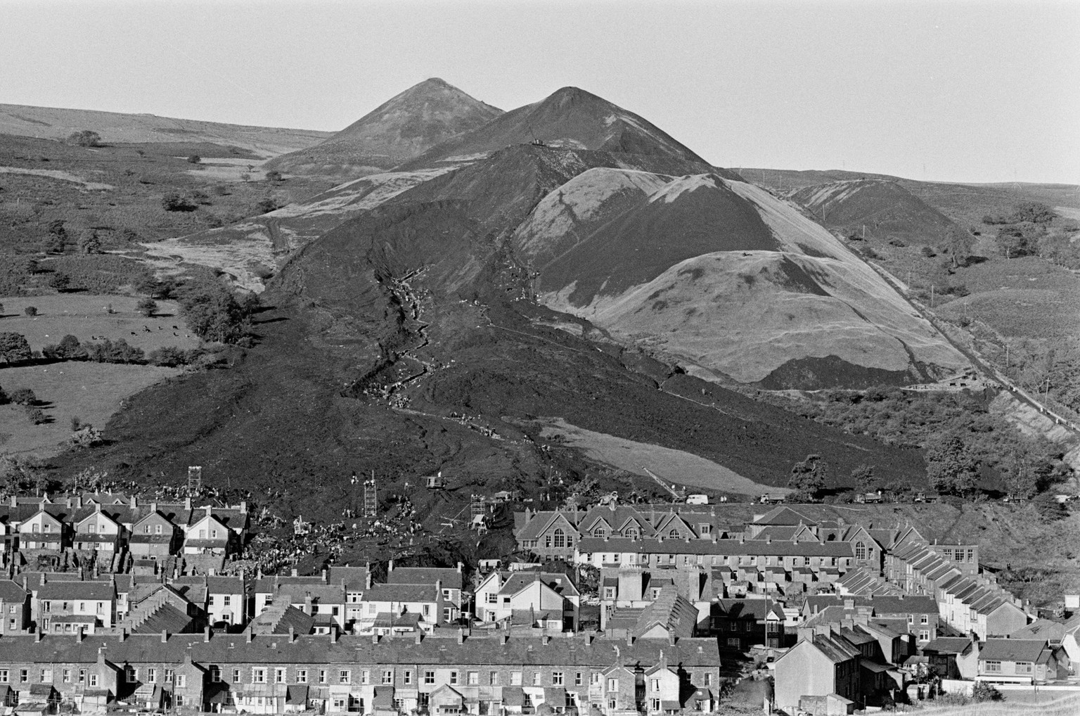 Aberfan, South Wales, circa October 1966: Picture shows the mud and devastation caused when mining spoil from the hillside high above the town behind came down and engulfed The Pantglas Junior School  ...
