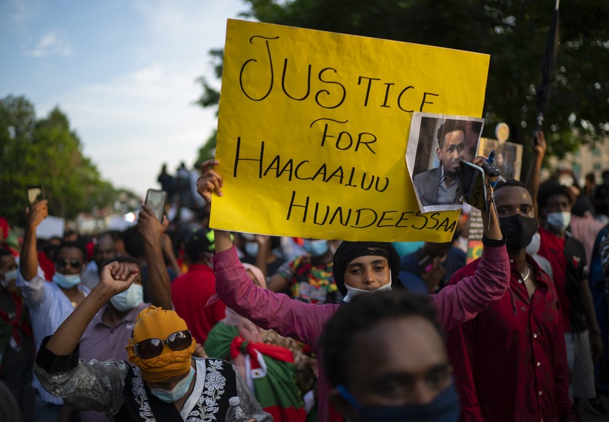 People walk along Lexington Avenue after exiting off westbound Interstate 94 on Wednesday, July 1, 2020, in St. Paul, Minn. Protesters apparently outraged by the killing of Hachalu Hundessa, a popular ...