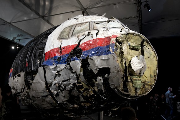 FILE - This Tuesday, Oct. 13, 2015 file photo, shows the reconstructed wreckage of Malaysia Airlines Flight MH17, put on display during a press conference in Gilze-Rijen, central Netherlands. Malaysia ...
