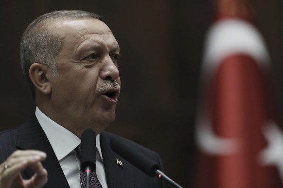 Turkish President Recep Tayyip Erdogan addresses his ruling Justice and Development Party legislators at the Parliament, in Ankara, Tuesday, Nov. 19, 2019. (AP Photo/Burhan Ozbilici)
Recep Tayyip Erdo ...