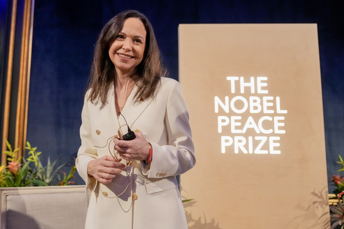 epa12584826 Nobel Peace Prize laureate Maria Corina Machado, accompanied by the head of the Nobel Committee Jorgen Watne Frydnes (not pictured) and the director of the Norwegian Nobel Institute Kristi ...