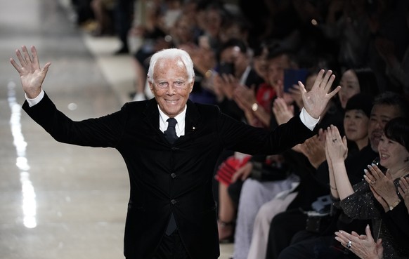 epa12351694 (FILE) - Italian fashion designer Giorgio Armani greets the audience after the presentation of his Cruise collection 2020 at the Tokyo National Museum in Tokyo, Japan, 24 May 2019 (04 Sept ...