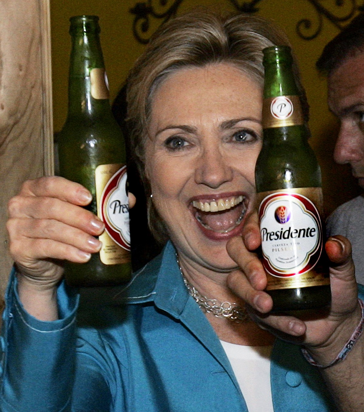Democratic presidential hopeful, Sen. Hillary Rodham Clinton, D-N.Y., hoists a "Presidente" beer at Sabor Latino Restaurant &amp; Bar in San Juan, Puerto Rico Sunday, May 25, 2008. (AP Photo ...