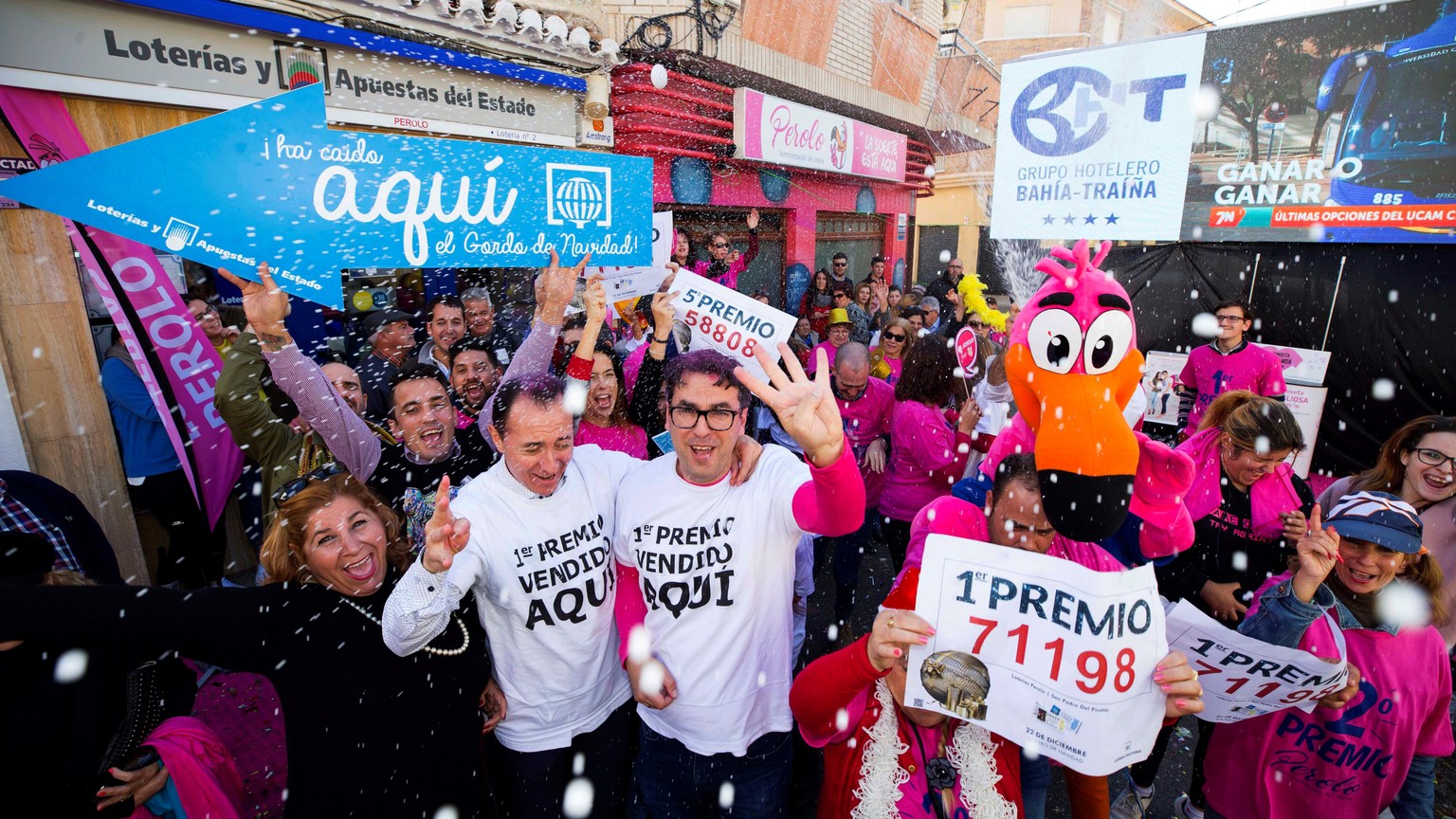 epa06403133 Workers of a lottery shop celebrate after learning thet they have sold one of the first prize tickets of the El Gordo (The Fat One) lottery in San Pedro del Pinatar, Murcia, southeast Spai ...