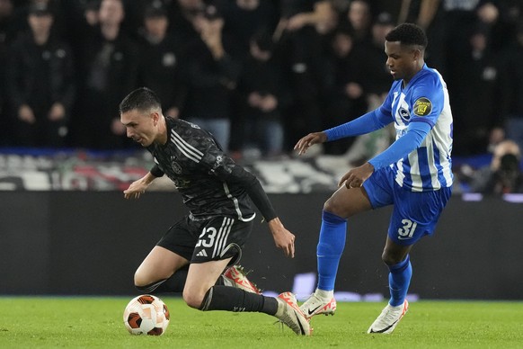 Brighton&#039;s Ansu Fati, right, vies for the ball with Ajax&#039;s Steven Berghuis during the Europa League Group B soccer match between Brighton and Hove Albion and Ajax at the Amex stadium in Brig ...