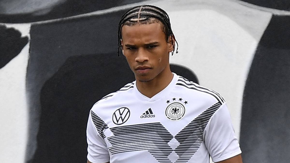 Germany's Leroy Sane holding his shoes arrives to a training of Germany's national soccer team in Venlo, Netherlands, Monday, June 3, 2019. Germany will play the next EURO 2020 qualifier mat ...