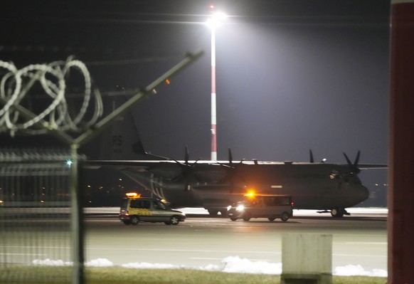 A U.S. Army transport plane with military equipment just after landing at the Rzeszow-Jasionka airport in southeastern Poland, on Friday, Feb. 4, 2022. Poland&#039;s Defense Ministry says that additio ...