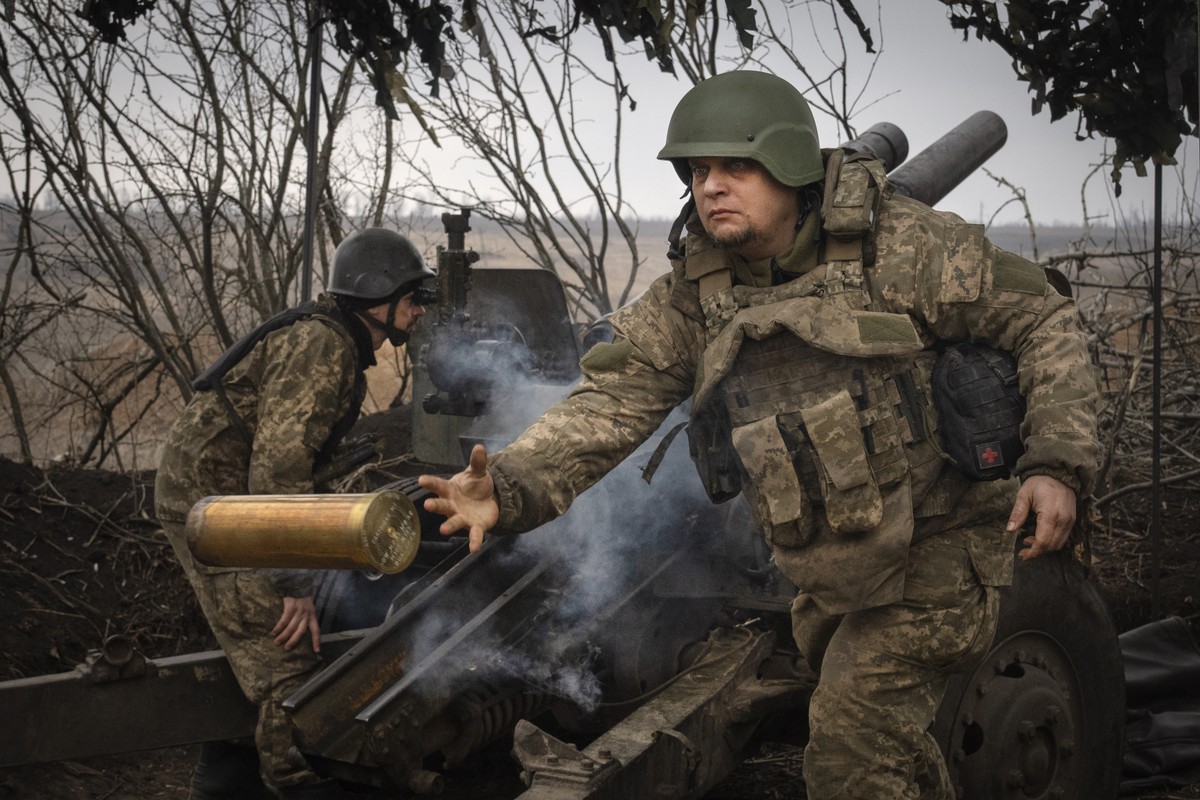 FILE - Ukrainian soldiers with the 71st Jaeger Brigade fire a M101 howitzer at Russian positions on the front line, near the city of Avdiivka in Ukraine's Donetsk region, on March 22, 2024. Appro ...