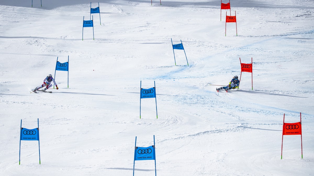 Wendy Holdener of Switzerland, left, in action against Paula Moltzan of the United States, right, during the 1/4 final of the women's Parallel race at the 2021 FIS Alpine Skiing World Championshi ...