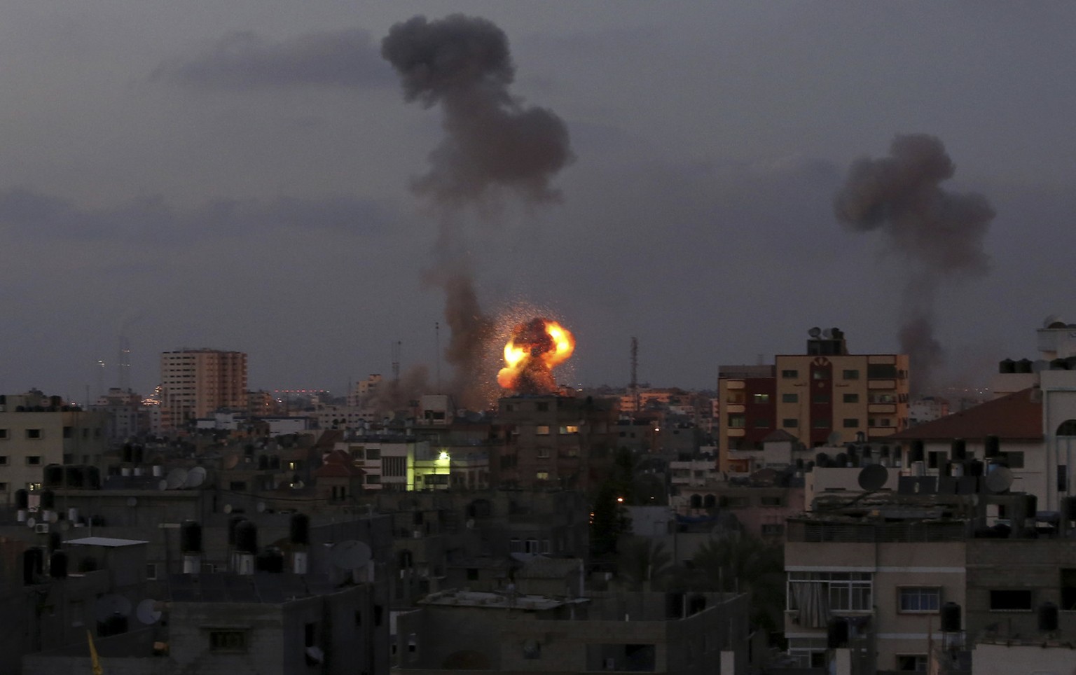Smoke and a ball of fire rises after an Israeli missile strike in Beit Lahia, northern Gaza Strip, Tuesday, July 8, 2014. The Israeli military launched what could be a long-term offensive against the  ...