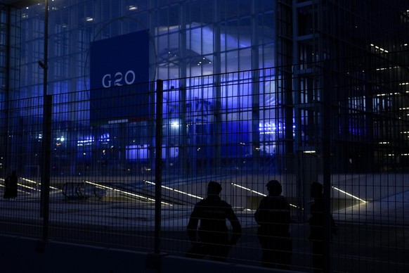 Italian police patrol in front of La Nuvola (the cloud) convention center where the G20 summit is scheduled to take place in Rome, Thursday, Oct. 28, 2021. A Group of 20 summit scheduled for this week ...