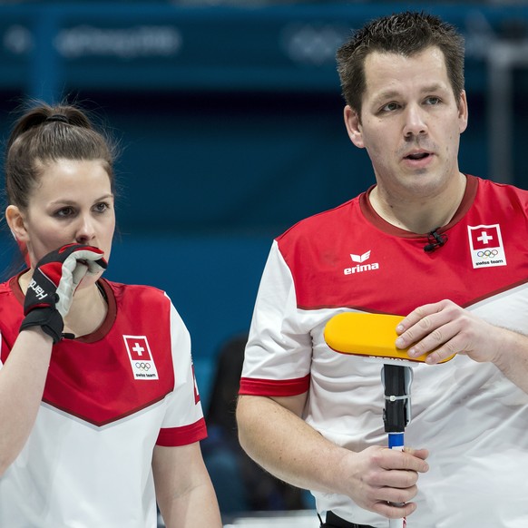 Jenny Perret of Switzerland and Martin Rios of Switzerland, from left, in action during the Mixed Doubles Curling round robin game between Switzerland and Finland one day prior to the opening of the X ...