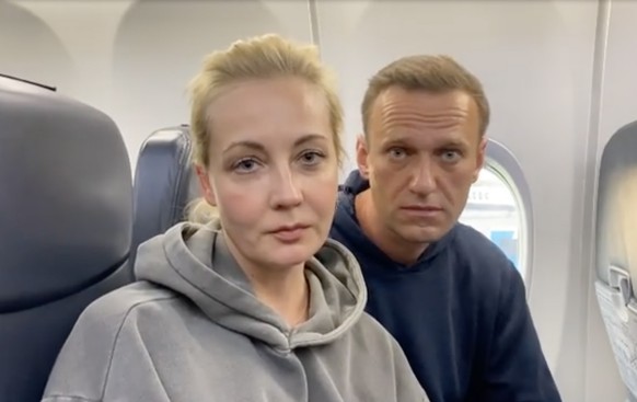 epa08959647 A frame grab of Alexei Navalny and Yulia Navalnaya taken from a video posted on the Instagram account @navalny shows Russian opposition Leader Alexei Navalny before his flight at the Berli ...