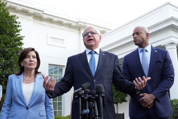 Minnesota Gov. Tim Walz, center, standing with New York Gov. Kathy Hochul, left, and Maryland Gov. Wes Moore, right, talks with reporters following their meeting with President Joe Biden at the White  ...