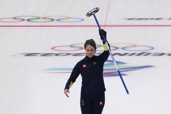 Sweden's Anna Hasselborg celebrates a shot during a women's curling semifinal match between Britain and Sweden at the Beijing Winter Olympics Friday, Feb. 18, 2022, in Beijing. (AP Photo/Nariman El-Mofty)