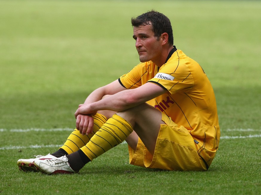 MOENCHENGLADBACH, GERMANY - MAY 23: Alexander Frei of Dortmund sits on the pitch looking dejected after the 1-1 draw after the Bundesliga match between Borussia Moenchengladbach and Eintracht Frankfur ...