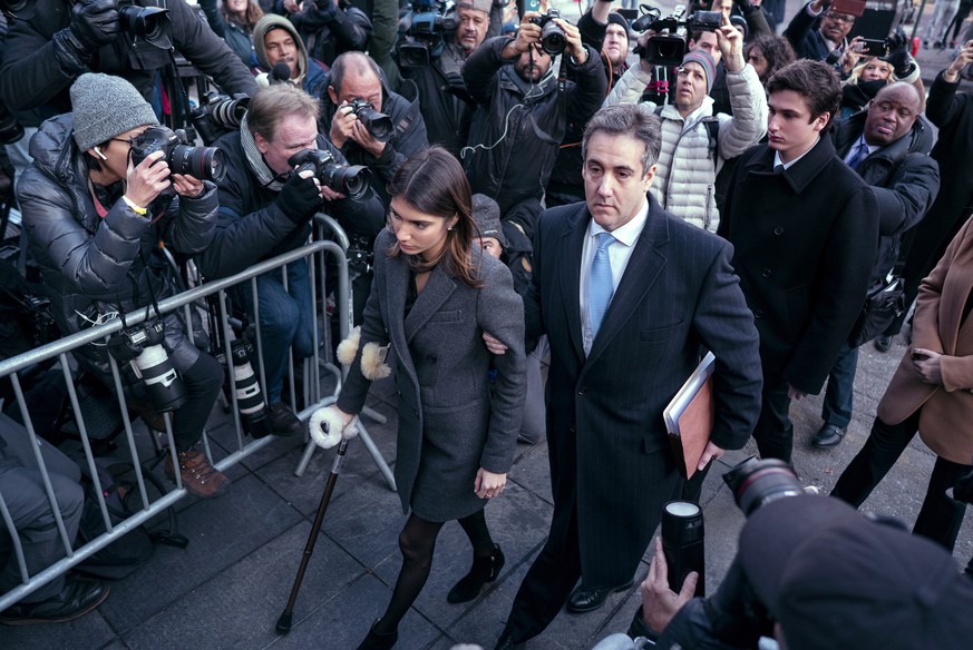 ADDS NAME OF FAMILY MEMBERS - Michael Cohen, center, President Donald Trump&#039;s former lawyer, accompanied by his children Samantha, left, and Jake, right, arrives at federal court for his sentenci ...
