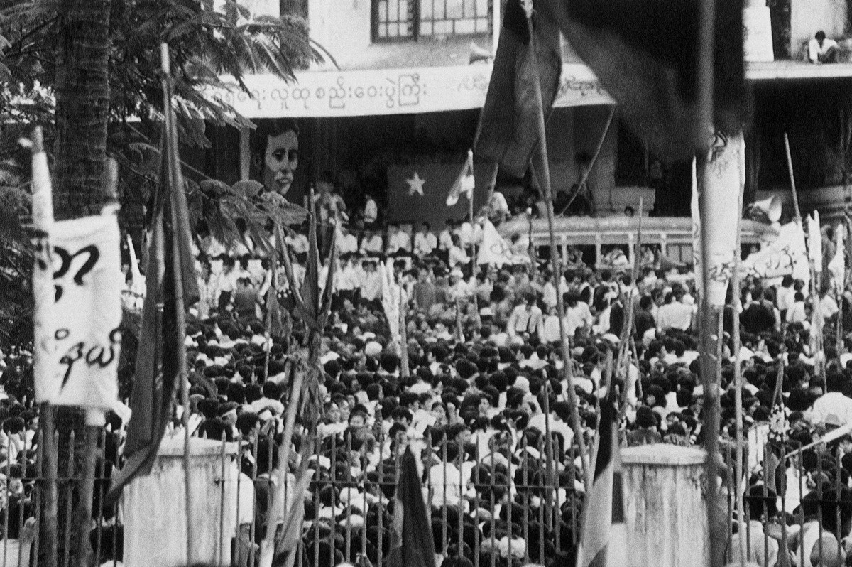 FILE - In this Aug. 27, 1988, file photo, people gather to listen to Aung San Suu Kyi, daughter of slain national hero Aung San, speak in Rangoon, Burma, now known as Yangon. Myanmar's military h ...