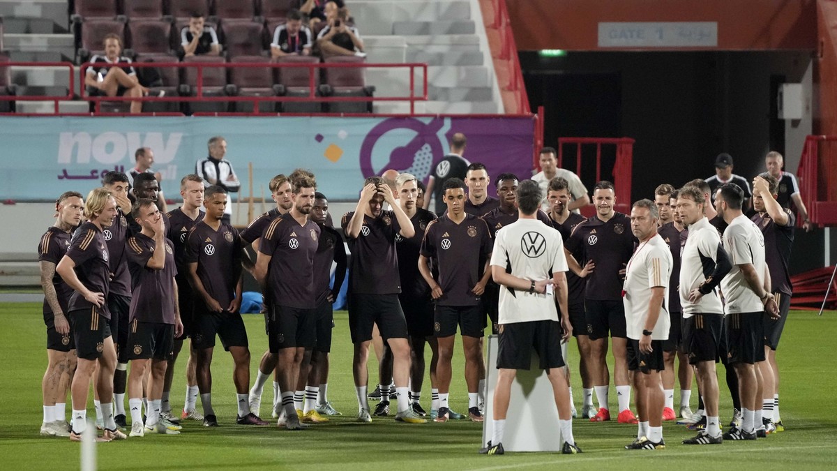 Germany's head coach Hansi Flick and his team gather during a training session at the Al-Shamal stadium on the eve of the group E World Cup soccer match between Germany and Spain, in Al-Ruwais, Q ...