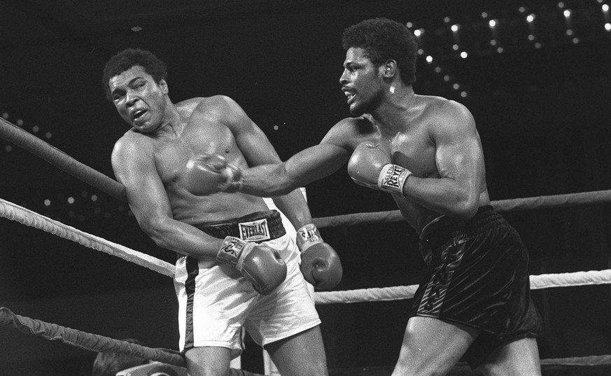 FILE - Leon Spinks connects with a right hook to Muhammad Ali, in this Feb.16, 1978 file photo taken during the late rounds of their championship fight in Las Vegas, Nev. The 24-year-old Spinks won th ...