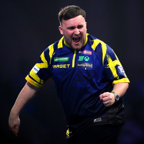 England's Luke Littler reacts during his match against England's Rob Cross on day sixteen of the World Darts Championship at the Alexandra Palace, in London, Monday, Dec. 29, 2025. (John Wal ...