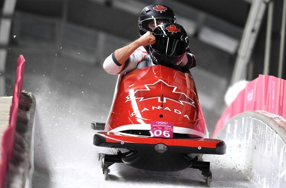 epa06542398 Justin Kripps (front) and Alexander Kopacz (back) of Canada react at the finish of the Men&#039;s 2-man Bobsleigh competition at the Olympic Sliding Centre during the PyeongChang 2018 Olym ...