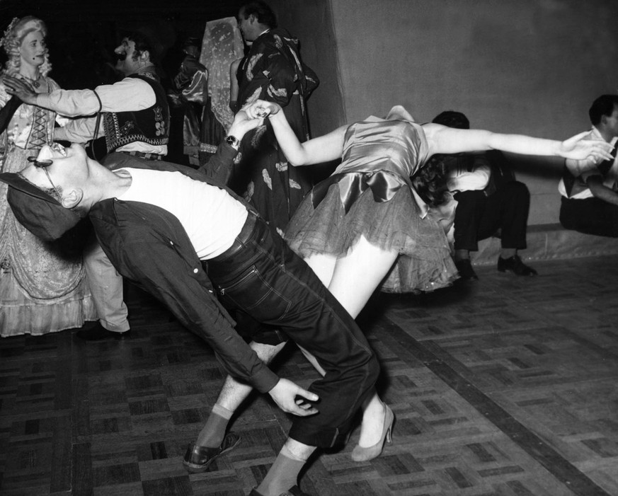 Dancers at the Chelsea Arts Ball held at the Roayl Albert Hall to see in the New Year for 195731st December 1956. (Photo by Daily Mirror/Mirrorpix via Getty Images)