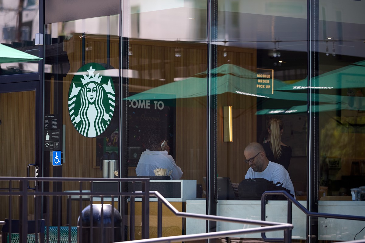 epa12269409 People sit inside Starbucks in Los Angeles, California, USA, 28 July 2025. Starbucks is expected to release the company's fiscal third quarter of 2025 earnings report on 29 July 2025, ...